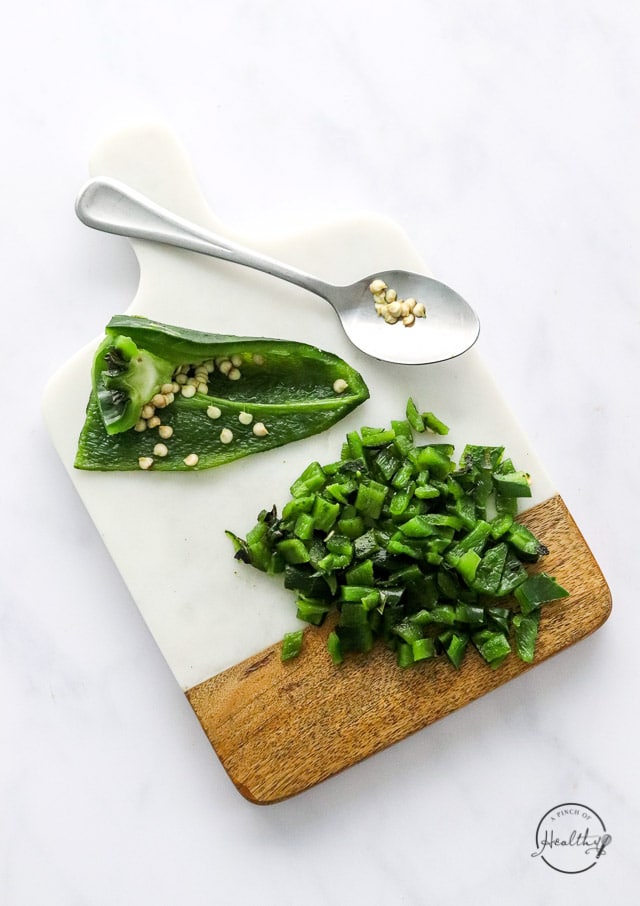 chopped charred poblano pepper on cutting board