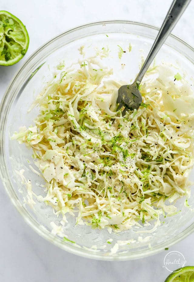 coleslaw in a bowl with fork