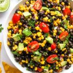 closeup of black bean salad in a white serving bowl