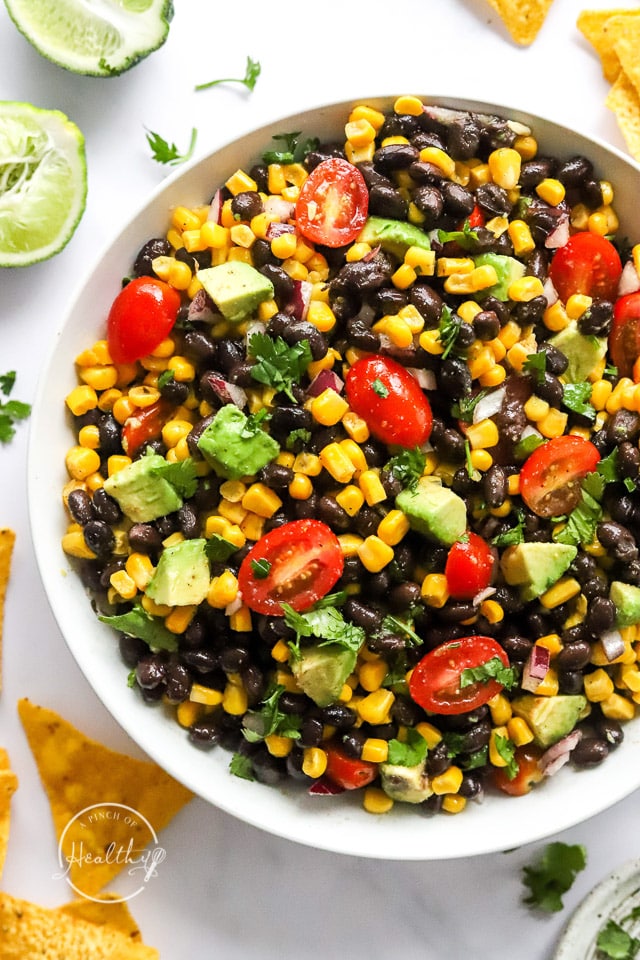 closeup of black bean salad in a white serving bowl