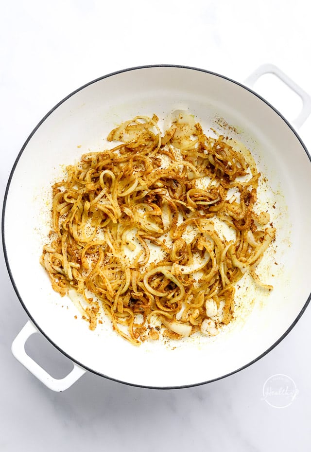 onions and spices cooking in a pot