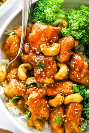 closeup of cashew chicken with fork