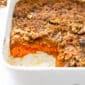 Styled sweet potato casserole closeup in a casserole dish