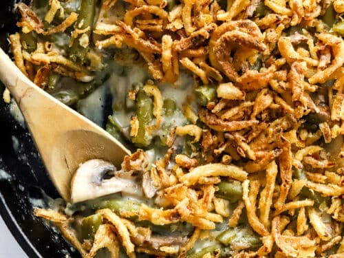 closeup shot spooning out a serving of vegan green bean casserole