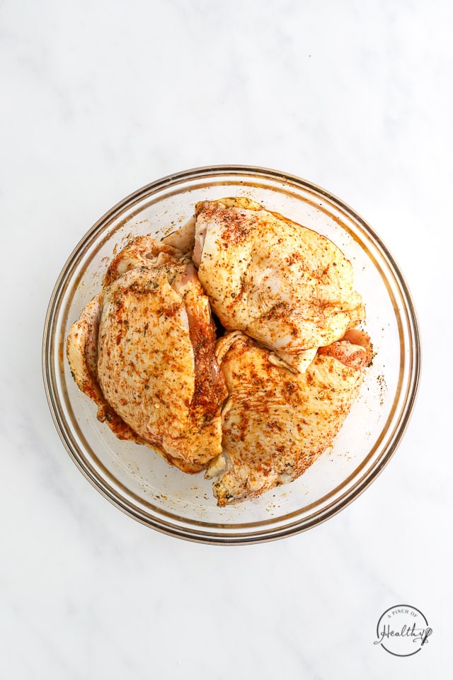 seasoning raw meat, tossed in a bowl