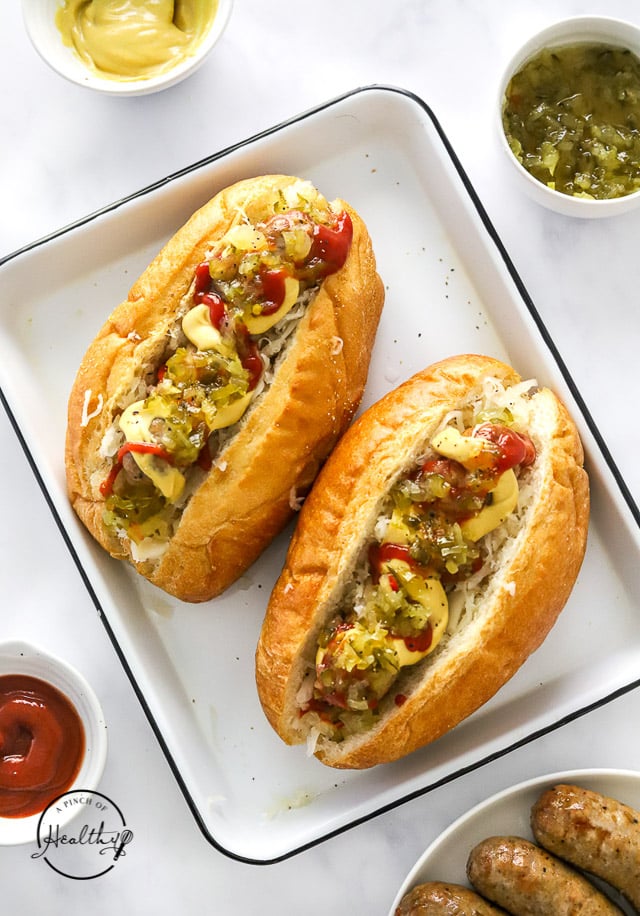 Styled Air Fryer Bratwursts in a hoagie roll with toppings