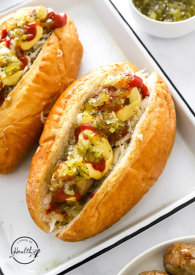 Air Fryer Bratwurst in hoagie roll with toppings