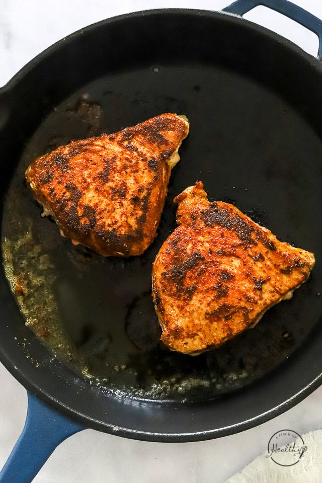 Cooked tuna steaks in a cast iron skillet