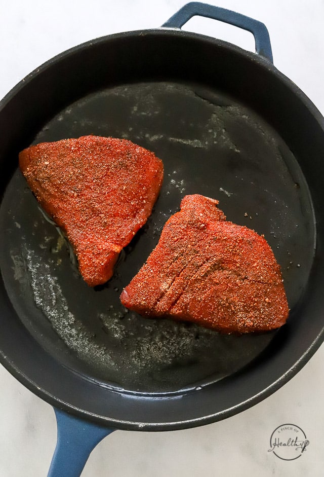 Searing the steaks in a pan
