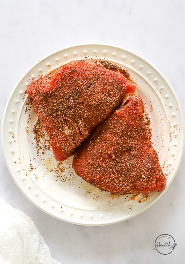 Seasoned raw fish on a plate