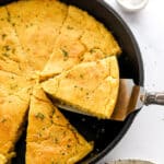 sliced vegan cornbread in a skillet