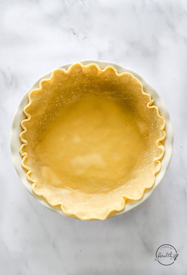 Par-baked pie crust in pie dish