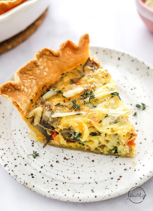 Slice of the BEST Vegetarian Quiche on a plate