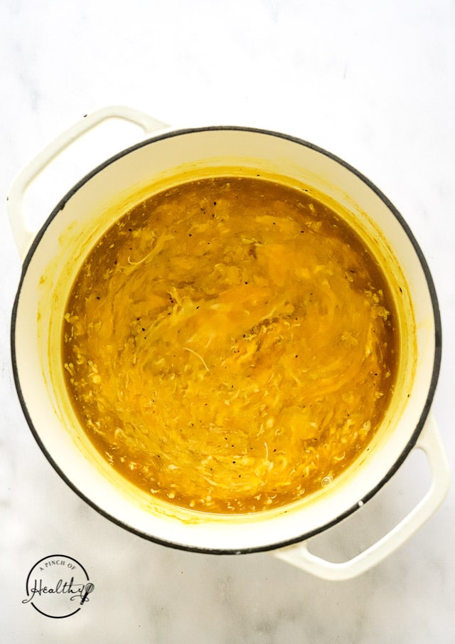 Homemade egg droop soup in a large pot