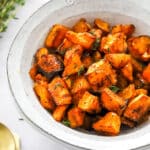 air fryer butternut squash in a white serving bowl