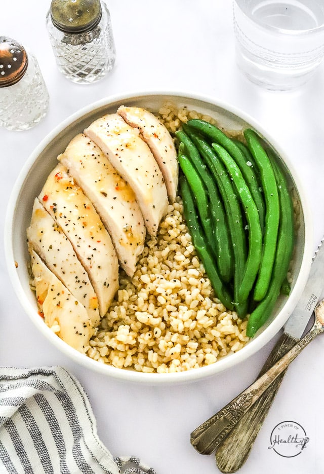 Italian dressing chicken in a bowl qith rice and green beans