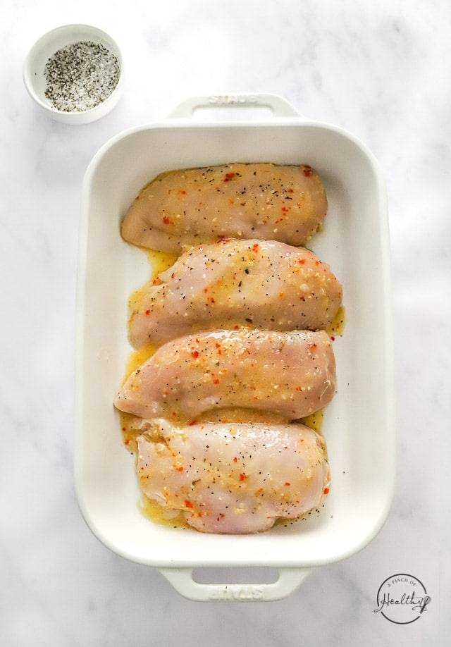 Marinated uncooked meat in dish