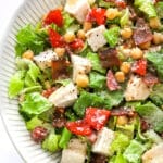 Jennifer Aniston salad in a bowl with wood salad serving utentils