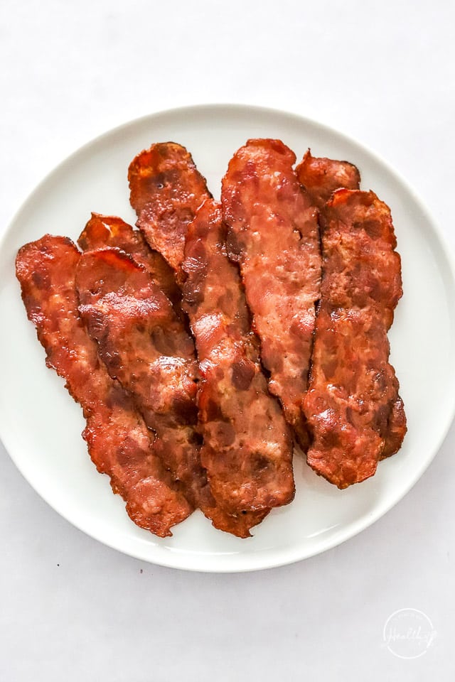 Air fryer turkey bacon on white plate