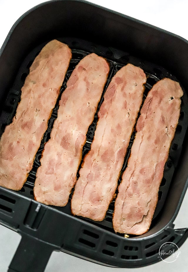 raw turkey bacon in air fryer basket