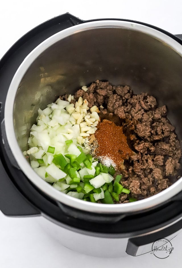 beef and veggies satuéing in an Instant Pot