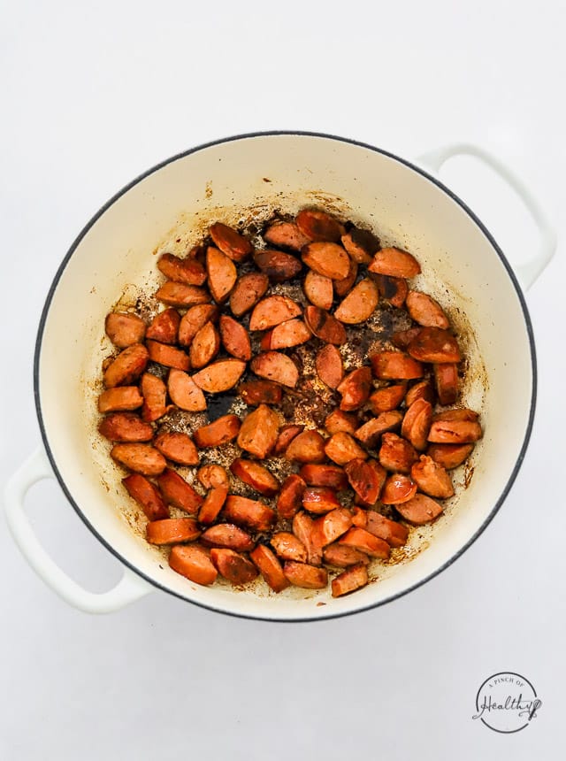 cooking sausage in a pot