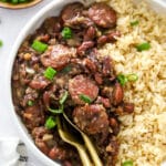 red beans and rice in a white bowl with spoon, closeup