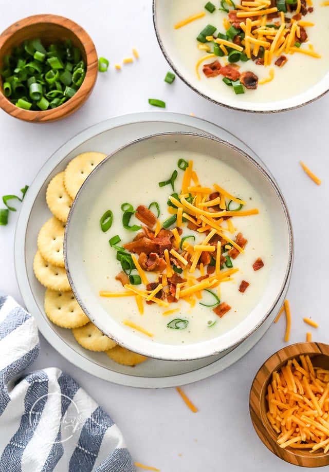 Instant Pot Potato Soup in a bowl with crackers on the side