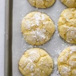 baked lemon crinkle cookies on a baking sheet