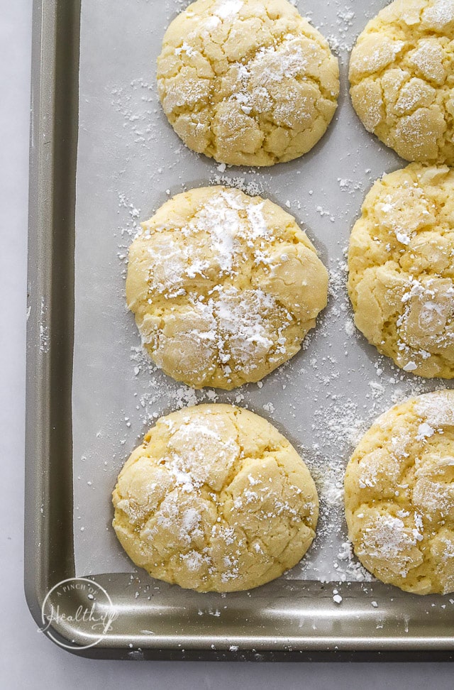 baked lemon crinkle cookies on a baking sheet