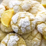 Lemon Crinkle Cookies stacked on a serving plate