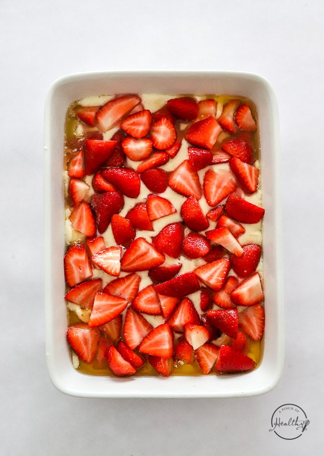 Assembled strawberry cobbler before baking