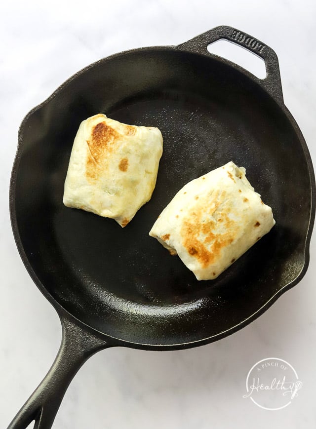 Cooking bean burritos in a cast iron skillet