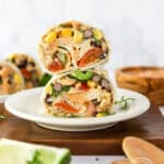 Bean Burritos styled on a plate cut open and stacked