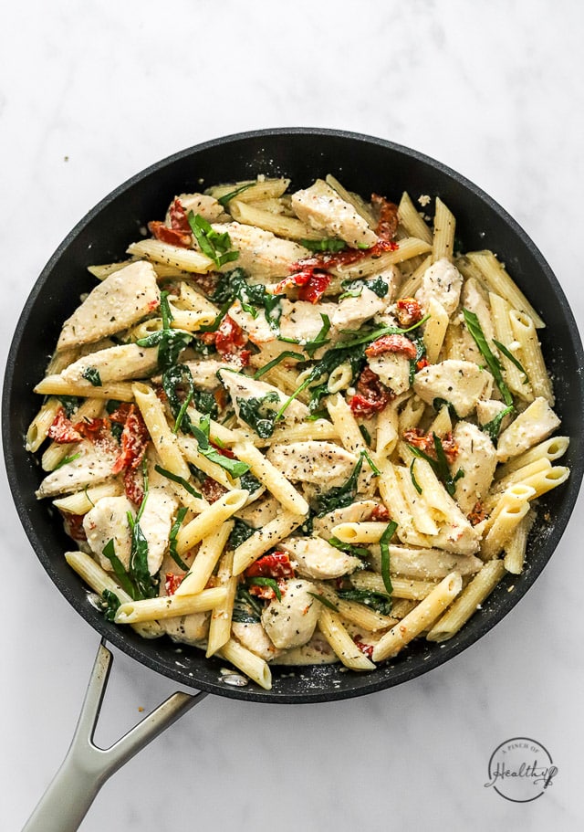 finished Tuscan chicken pasta in a pan