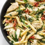 Creamy Tuscan Chicken Pasta in a pan, shot closeup