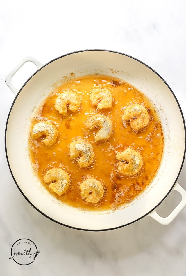 frying shrimp in a pan