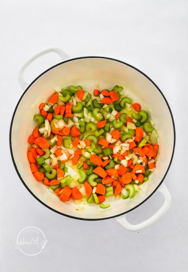 celery, onion, carrots and garlic in a pot