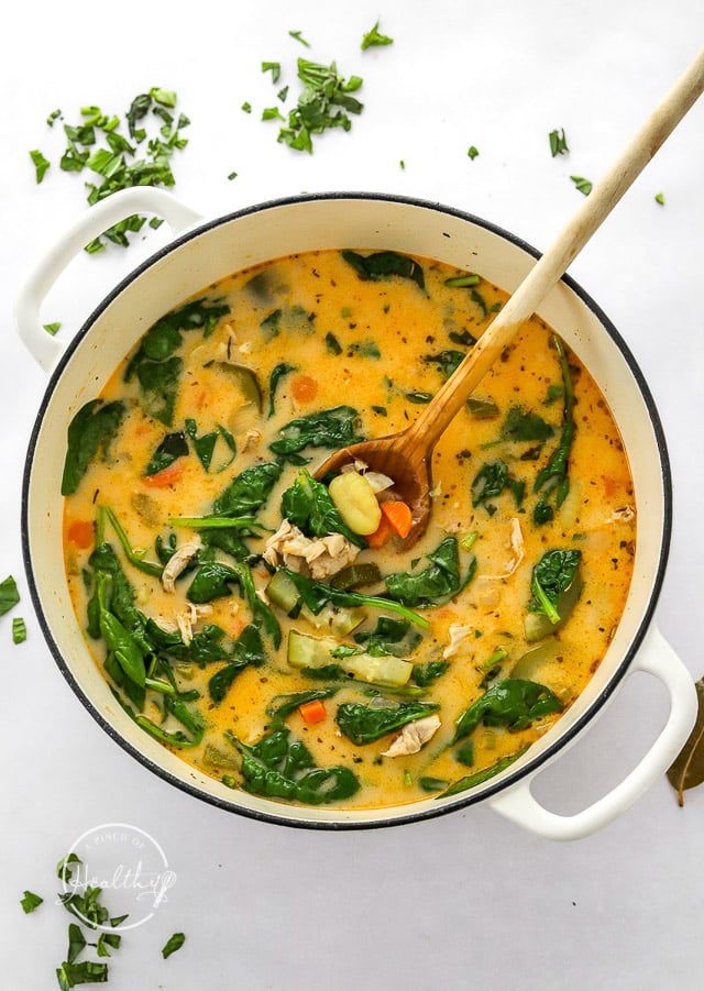 Chicken Gnocchi Soup in enameled cast iron pot with wooden spoon
