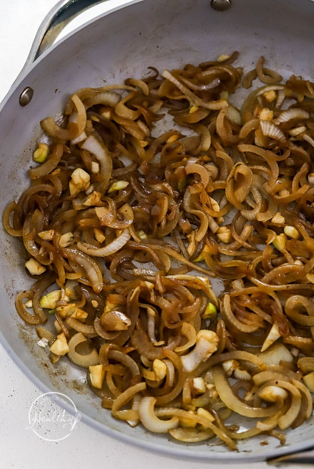 Cooking onions and garlic in a pan