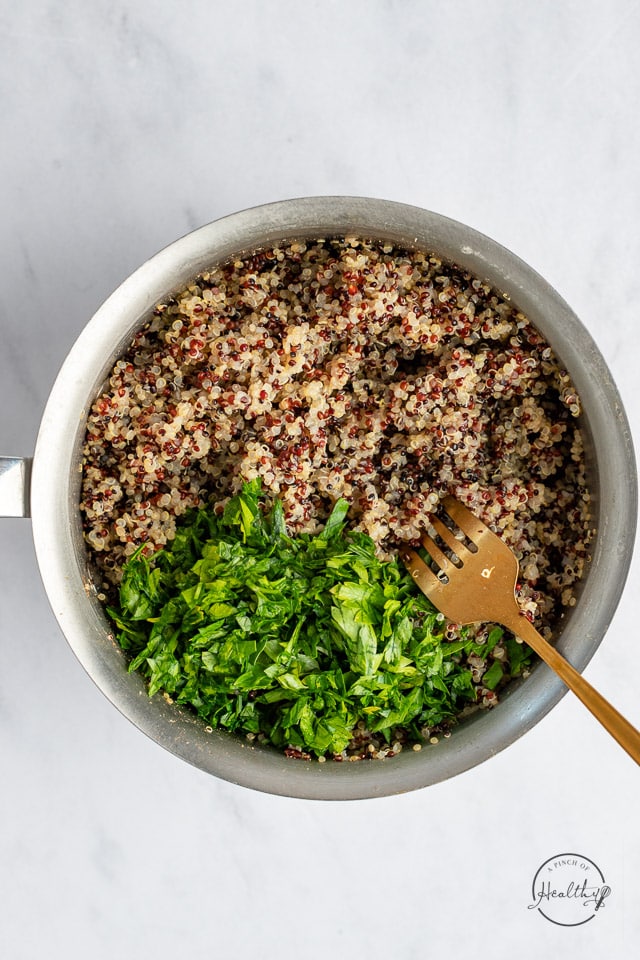 stirring fresh parsley into cooked quinoa