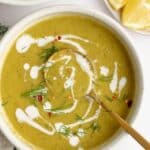 Asparagus soup with garnish in a white bowl