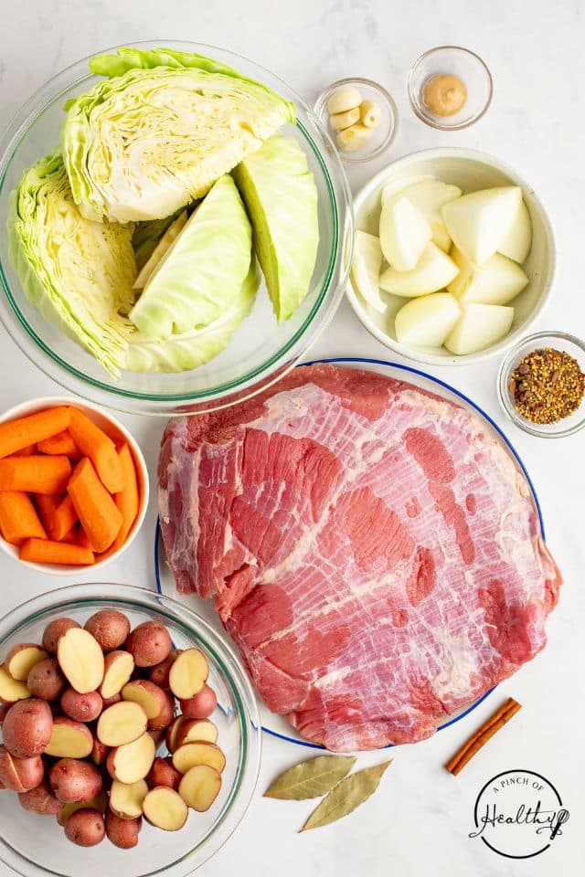 ingredients for corned beef and cabbage on a white background