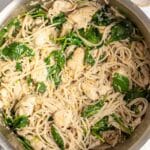 lemon chicken pasta with spinach in a large pot.