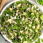 Pea salad shot from overhead in a white bowl