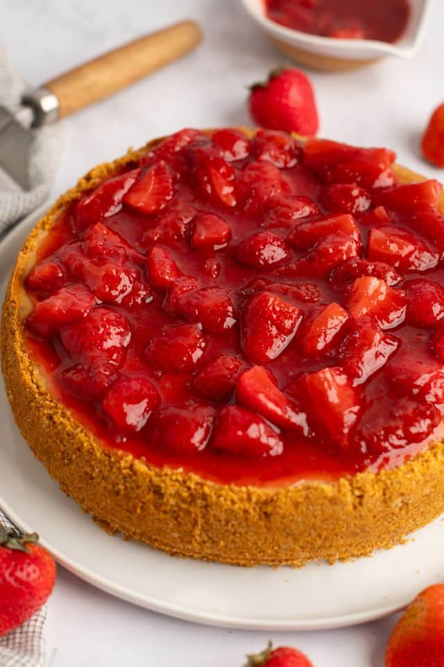 Strawberry cheesecake with topping on it