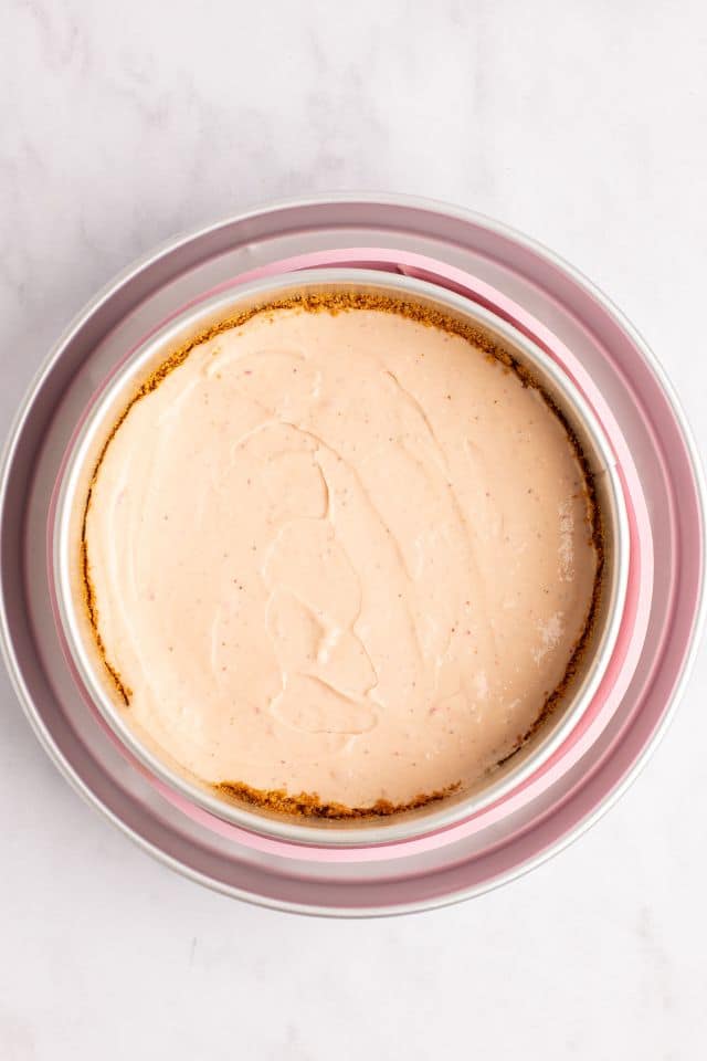 cheesecake batter poured over the graham cracker crust.