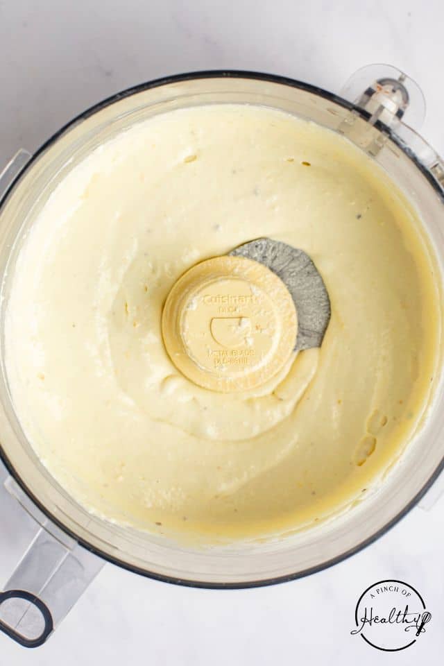 Whipped feta dip after the oil is mixed in and the dip is smooth and creamy.