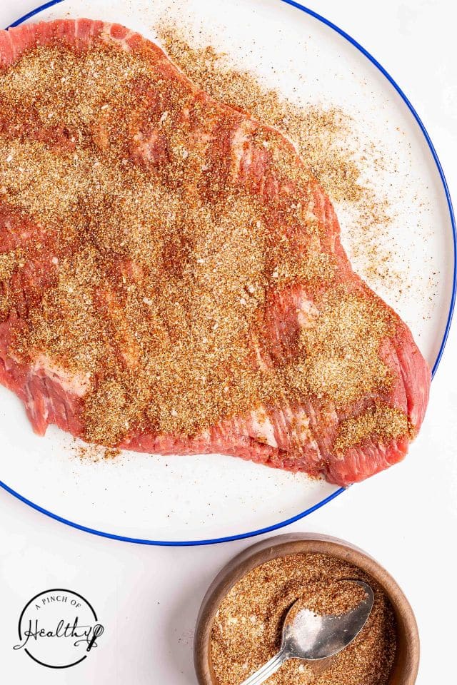 Seasoning blend liberally applied to the beef brisket.