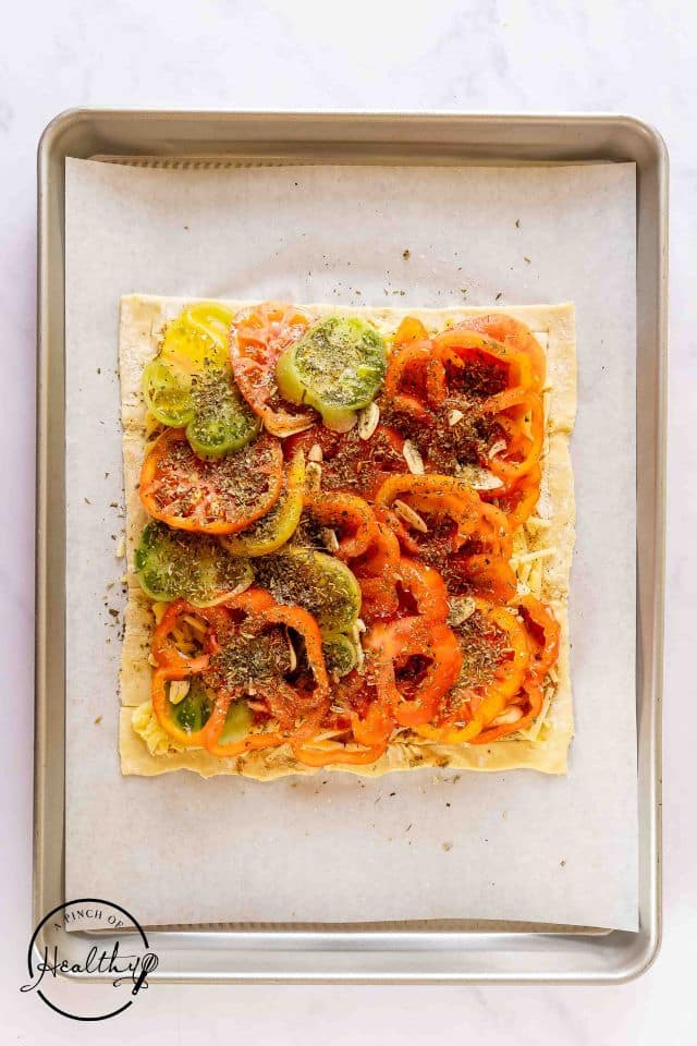 Honey and olive oil drizzled on top of the unbaked tomato tart.